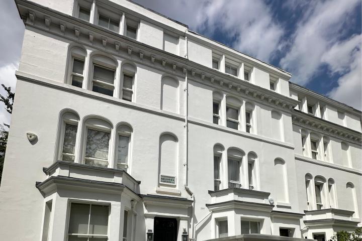 How do the climatic differences in different regions of the UK specifically affect property selection?